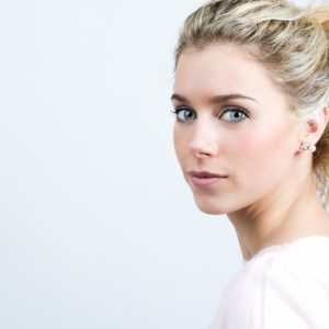 Portrait of Beautiful young blonde woman looking at the camera
